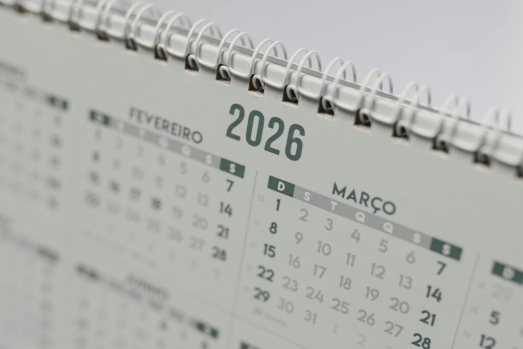 Close-up view of a 2026 spiral-bound desk calendar showing February and March.