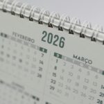 Close-up view of a 2026 spiral-bound desk calendar showing February and March.