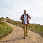 Man hiking on a scenic trail in Portugal, enjoying outdoor adventure and nature.